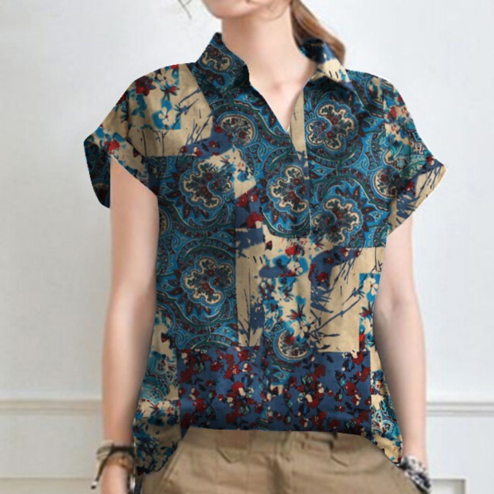 camicia donna estiva, camicia floreale, camicia estiva elegante, moda donna, abbigliamento femminile, top estivi, abbigliamento trendy, stile femminile, bluse donna, camicia donna estiva floreale elegante, abbigliamento femminile estivo di tendenza, top donna con fantasia floreale, moda femminile elegante e fresca, stile donna moderno e raffinato, blusa estiva trendy dal design floreale
