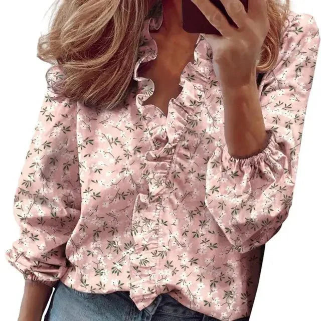 Blusa in tessuto morbido con maniche a sbuffo