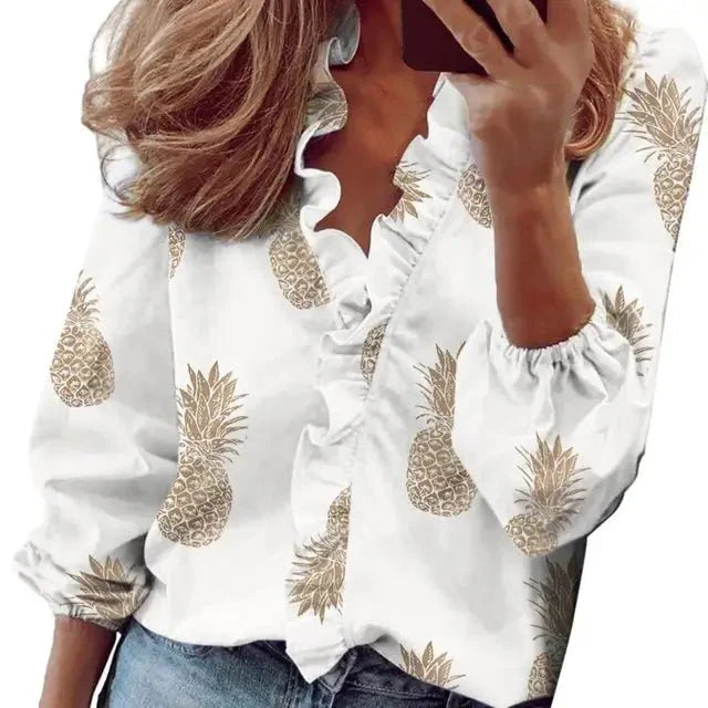 Blusa in tessuto morbido con maniche a sbuffo