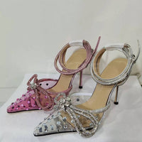 Tacchi trasparenti con strass e fiocco glitter