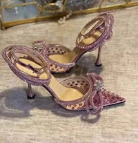 Tacchi trasparenti con strass e fiocco glitter