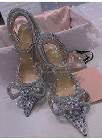 Tacchi trasparenti con strass e fiocco glitter